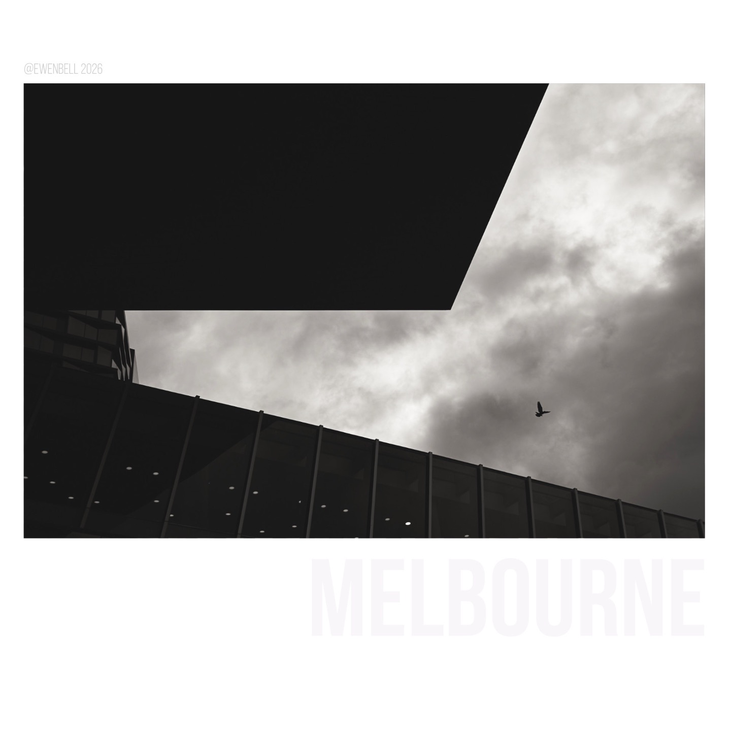 Heavy skies and a single gull looking for a place amongst the man made sky