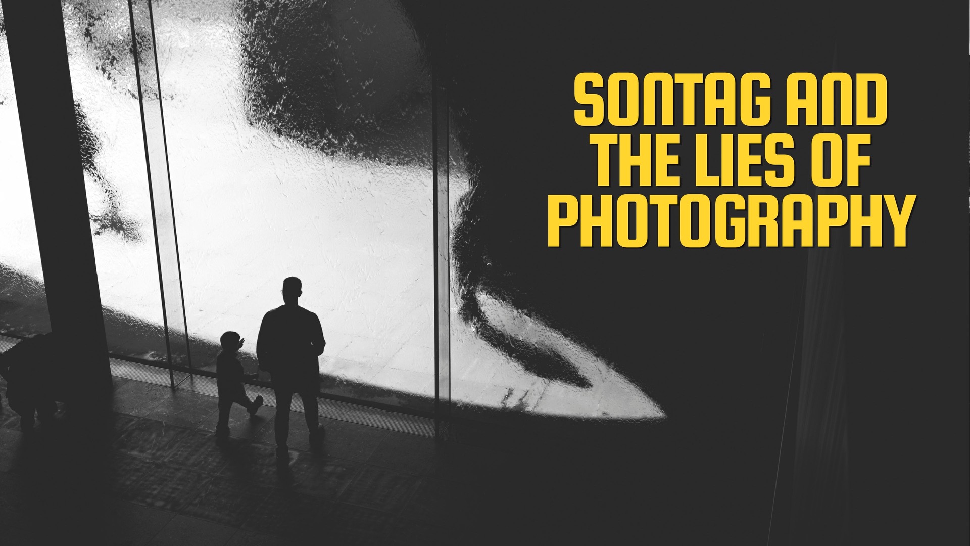 Thumbnail for the video. B+W silhouette of a man and his son approach the water wall at Melbournes NGV.